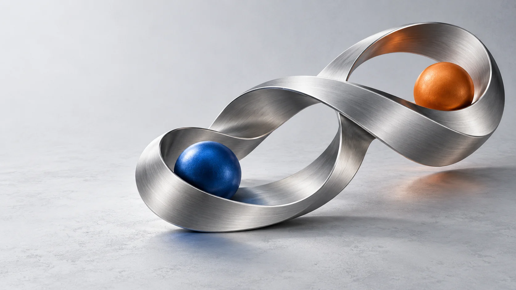 A sculptural silver ribbon connects cobalt and orange spheres, suggesting two reading directions